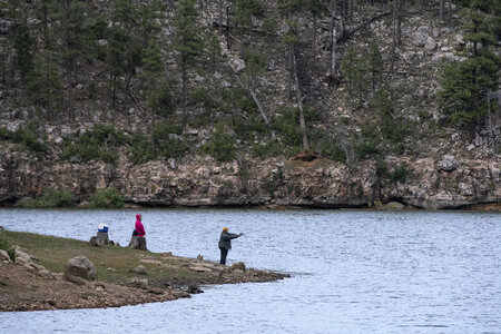American man fly fishing in a river