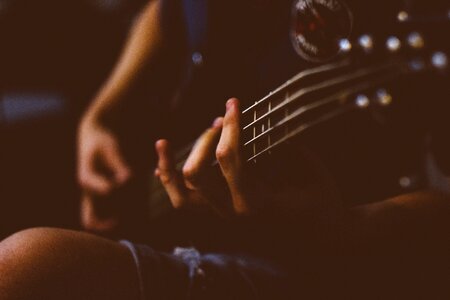 Closeup Playing Guitar photo