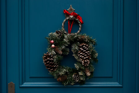 Christmas Wreath Hanging on Turquoise Wooden Door photo