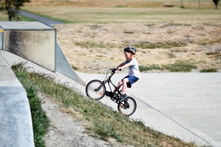 Little Boy Ride His Bike Uphill photo