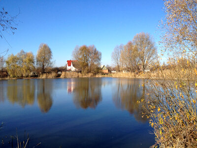 Pond and Houses landscape in Ukraine photo