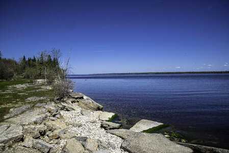 Rocky Shoreline of Lake Winnipeg with clear sky at Hecla Provincial Park photo