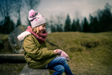 Child Girl in Warm Jacket and Hat photo