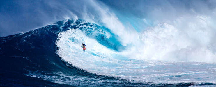 Surfer riding Giant Wave in Hawaii photo