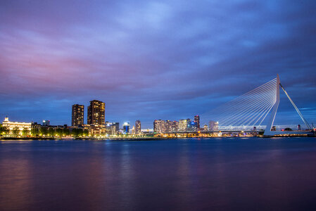 Skyline and Erasmus Bridge at night in Rotterdam, Netherlands photo
