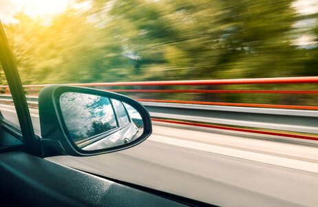 1 The reflection in the rear-view mirror of car in motion photo