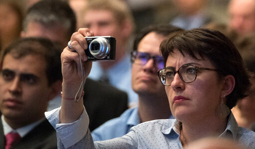 Woman taking photo with point and shoot Camera photo