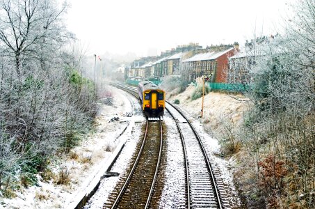 The running train covered snow photo