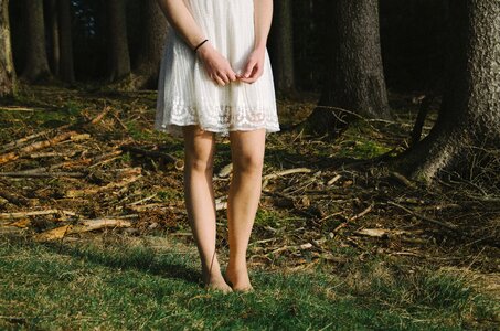 Woman legs forest photo
