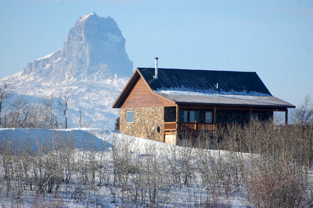 Cabin in the winter and landscape at Glacier National Park, Montana photo