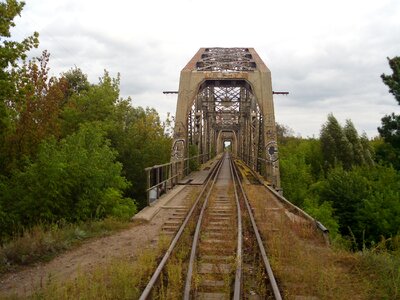 Old vintage railway bridge over river photo