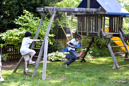 Babies playing swing photo