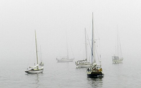 Mist water sailboat photo