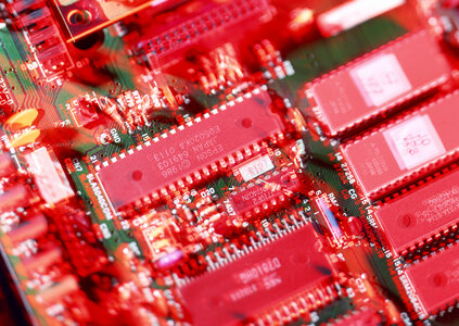 Detail of an electronic printed circuit board with many electrica photo