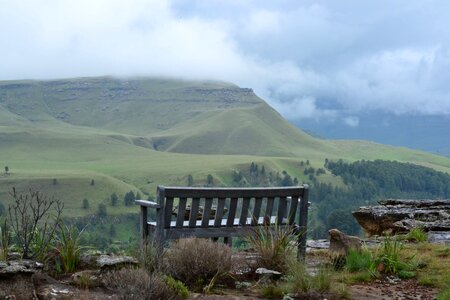 Bench clouds countryside photo