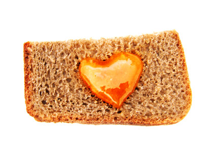 Bread with heart shaped honey photo