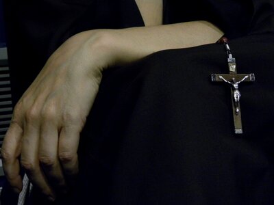 Prayer cross nun