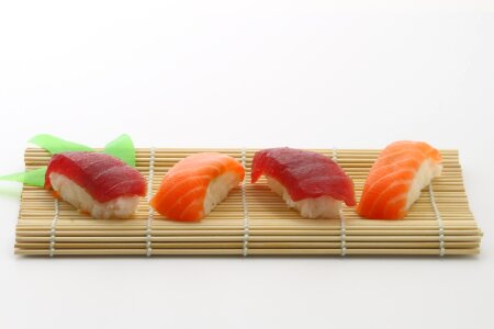 fish sushi on bamboo photo