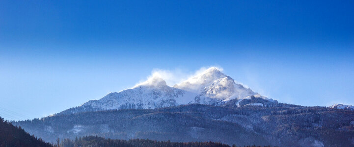 Snow capped mountain peaks in Steinbockweg Innsbruck, Austria photo
