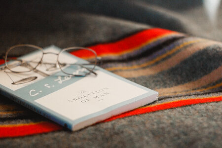 Glasses and Book on the Blanket photo