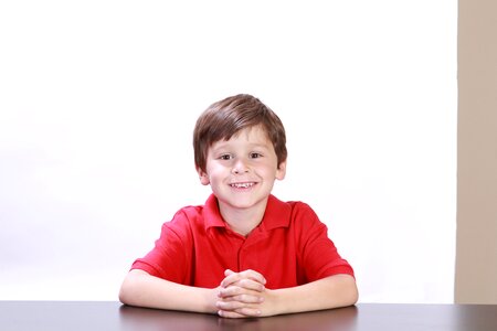 Children sitting red photo