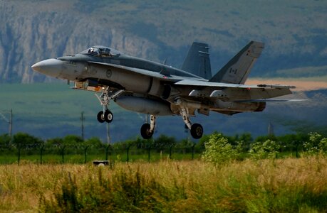 A F-18 Hornet takes off for training operations photo