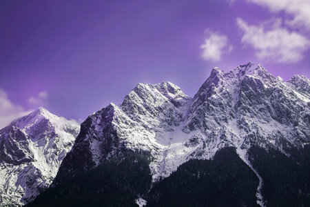 Mountain Peak in Snow against Violet Sky photo
