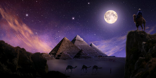 Pyramids with bright moon and stars