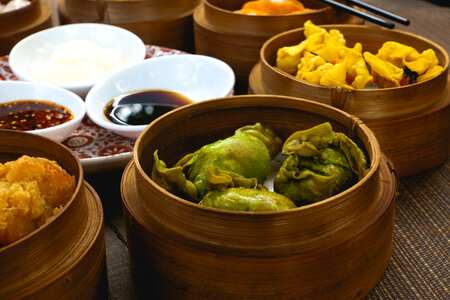 Chinese fried dim sum in wooden steamers photo