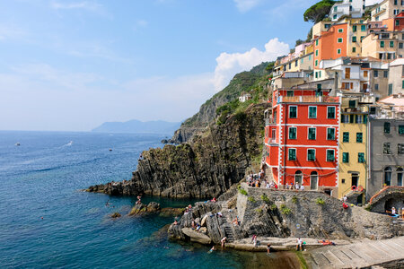 View of the Colorful Houses Along the Coastline of Cinque Terre Area in Riomaggiore, Italy photo