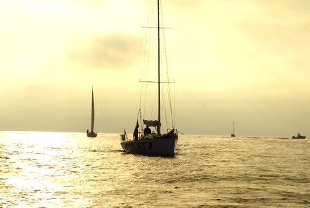 Sailboat sunrise yole photo