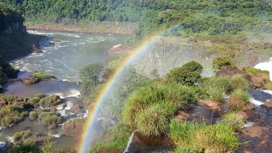 Iguassu waterfalls with rainbow on a sunny day photo