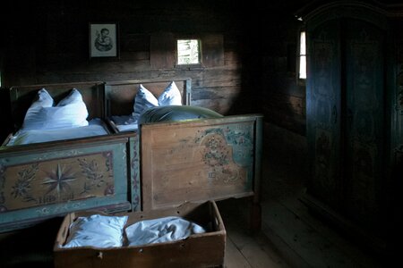 Hand-painted beds white linen subdued light