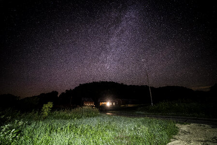 Stars behind the house and hills at Hogback Prairie photo