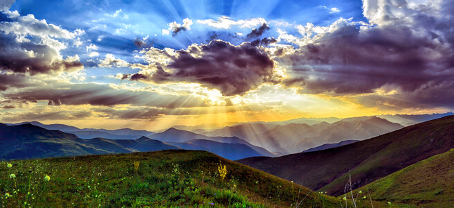 Sunrays behind the clouds photo