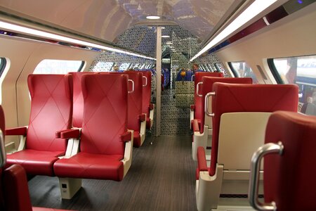 Interior of a passenger train with empty seats photo