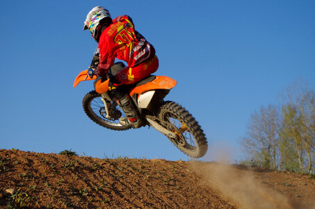 Dirt Biker jumping off a hill