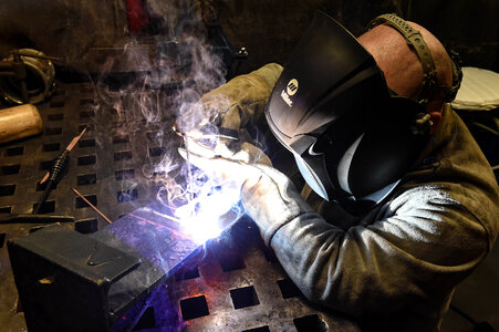 Industrial Worker at the factory welding closeup