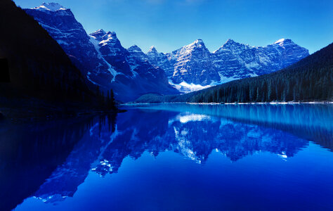 Blue Waters of the reflective lake at Banff National Park, Alberta, Canada photo