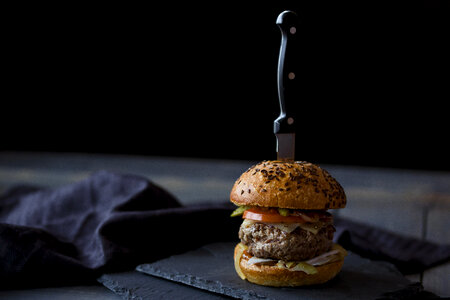 Beef burger slider with knife in it photo