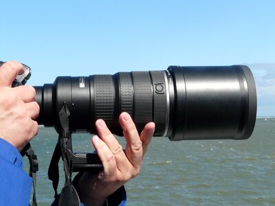 Camera tripod recording photographer