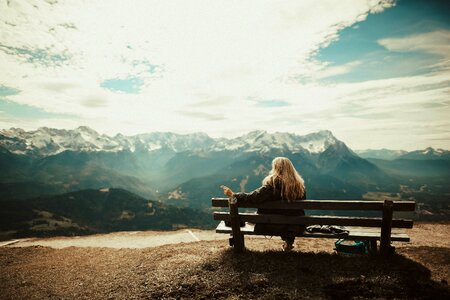 Woman Sitting Bench View Mountains photo