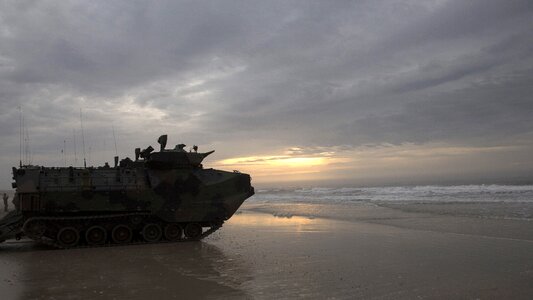 Assault amphibious vehicles sit silently on Onslow Beach photo