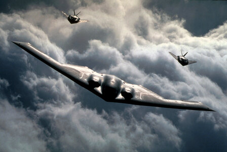 A U.S. Air Force B-2 Spirit and two B-117A Nighthawks fly photo