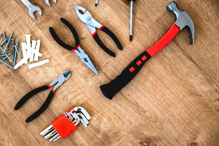 4 Construction tools on the wooden background. photo