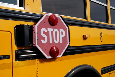 Stop sign yellow schoolbus photo