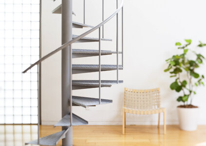 modern white staircase with wooden floor and glass barrier photo