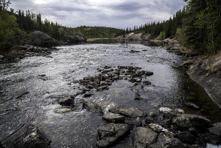 Landscape and Scenery of the Cameron River under clouds and forest