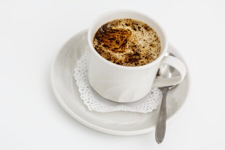 Cup of coffee over white background photo