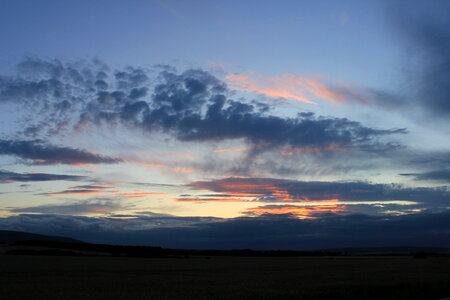 Sundown behind fields photo